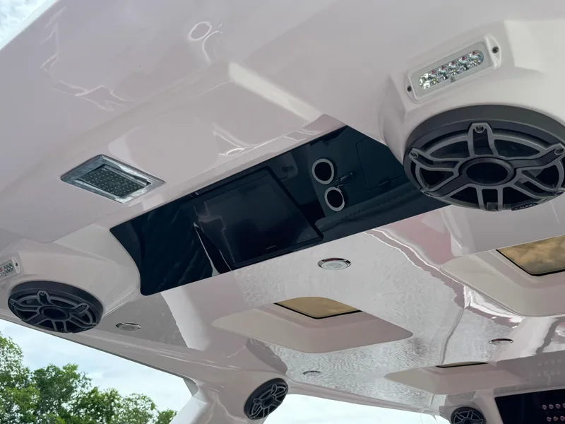 Slide: The Image of Ceiling view of 2022 Deep Impact 399 boat with speakers and lights. - 27