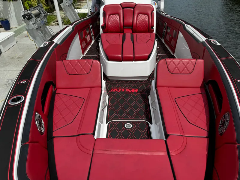 Slide: The Image of Luxurious red interior of 2022 Deep Impact 399 boat with diamond-patterned seating. - 29