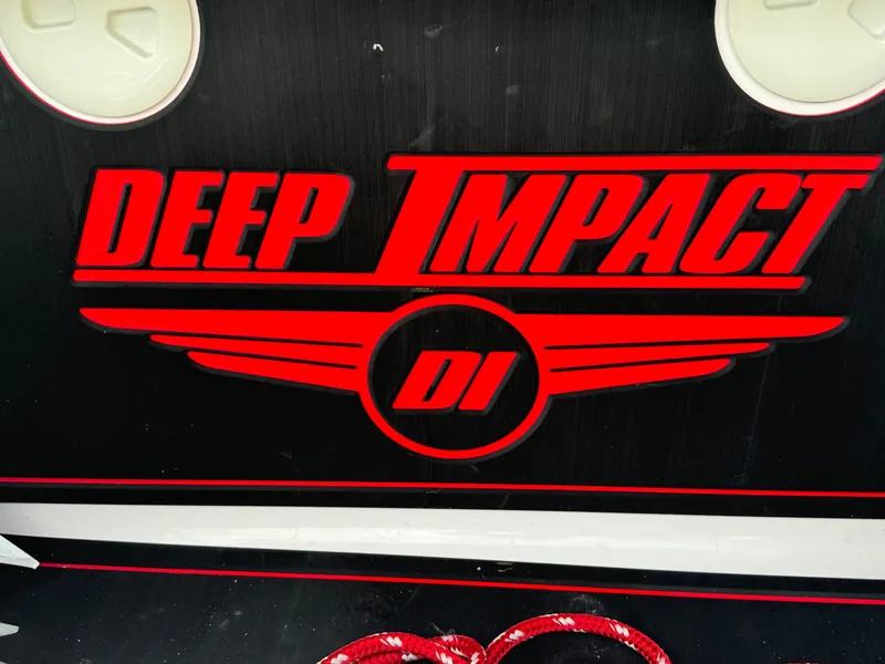 Slide: The Image of Red "Deep Impact" logo on black background, 2022 model 399. - 46