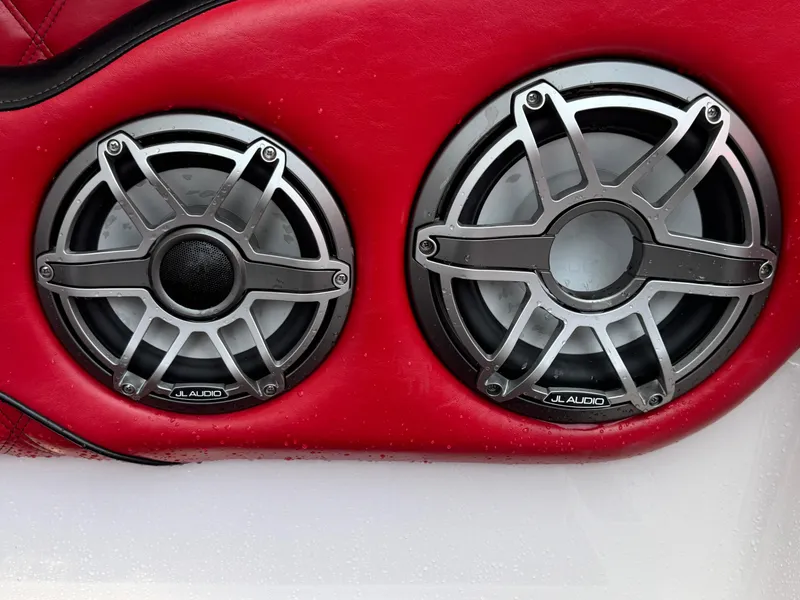 Slide: The Image of Dual JL Audio speakers on red leather, Deep Impact 399 model, 2022. - 47