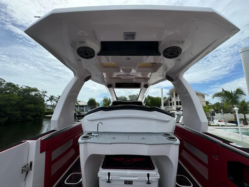 Slide: The Image of Interior view of 2022 Deep Impact 399 boat with modern amenities and sleek design. - 7