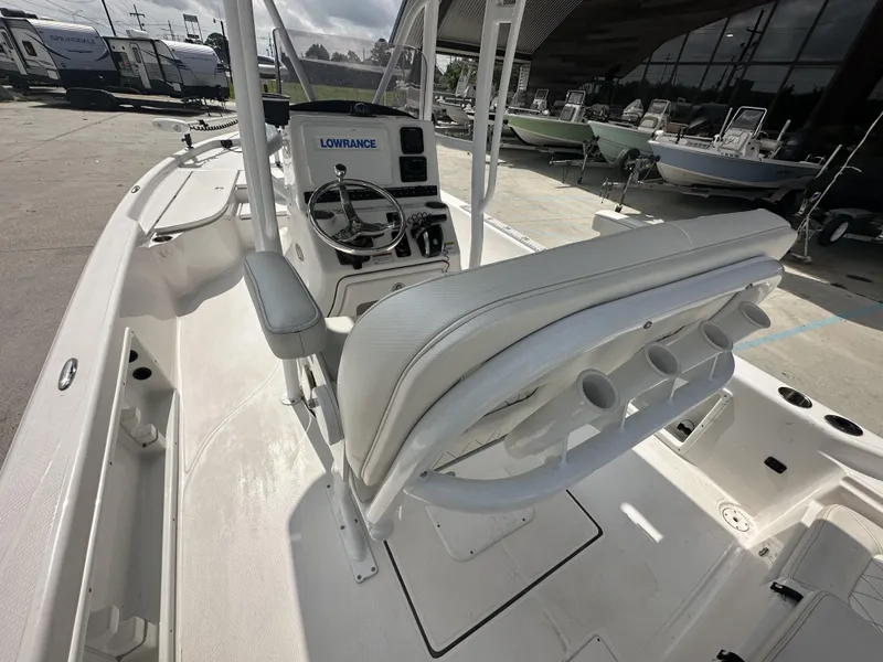Slide: The Image of 2022 Blue Wave 2400 PURE BAY boat interior with Lowrance electronics and rod holders. - 12
