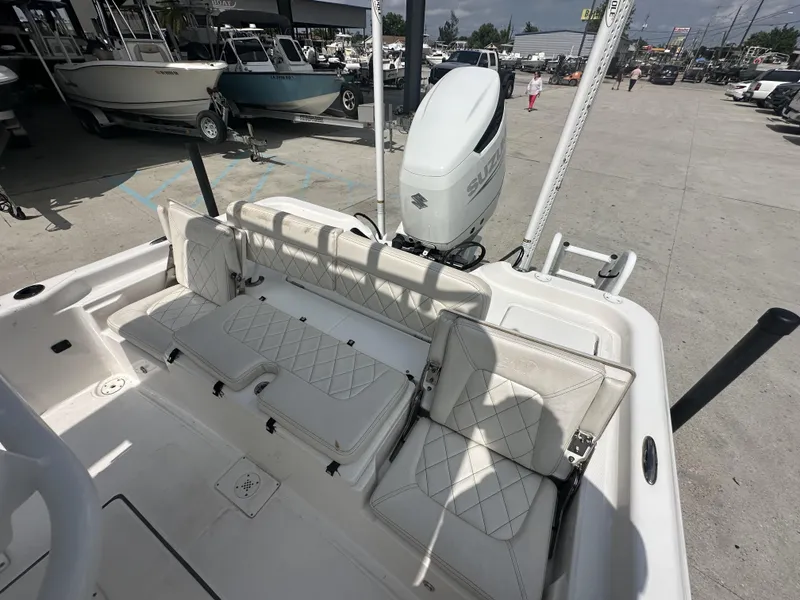 Slide: The Image of 2022 Blue Wave 2400 PURE BAY boat with Suzuki outboard motor and white seating. - 3