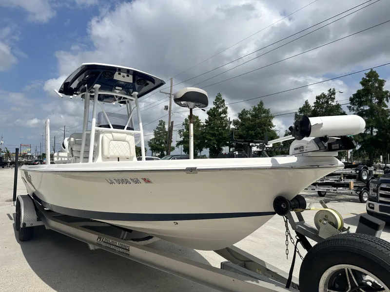 Slide: The Image of 2022 Blue Wave 2400 PURE BAY boat on trailer under cloudy sky. - 4