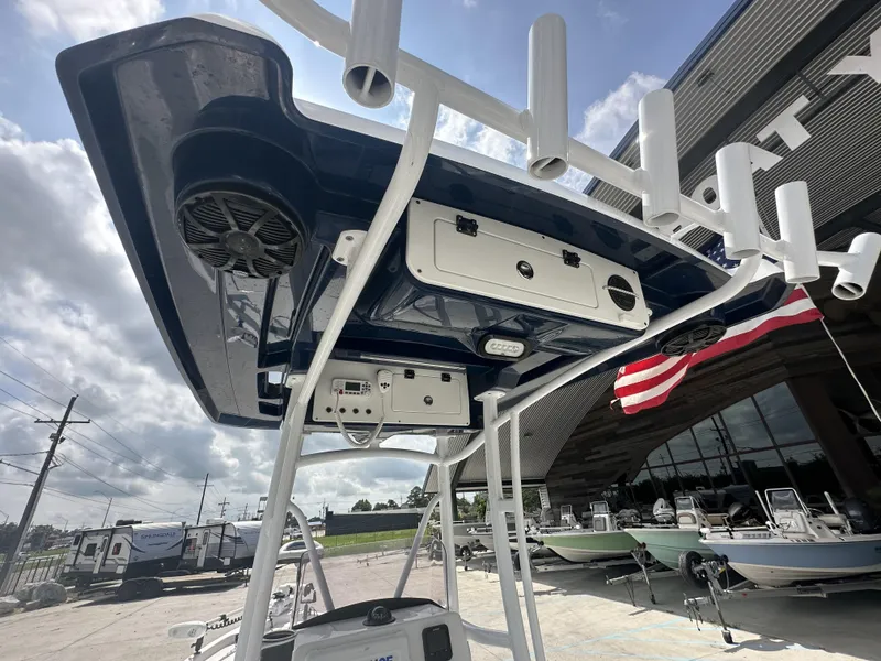 Slide: The Image of 2022 Blue Wave 2400 PURE BAY boat with T-top and rod holders. - 5