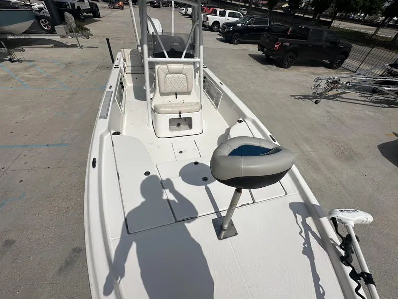 Slide: The Image of 2022 Blue Wave 2400 PURE BAY boat interior with seating and fishing equipment. - 6