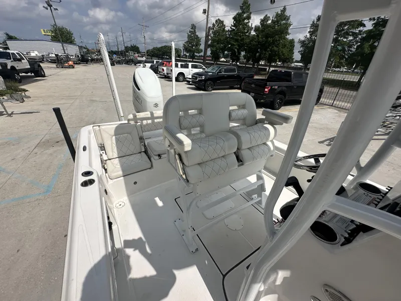 Slide: The Image of 2022 Blue Wave 2400 PURE BAY boat interior with white seating and console. - 7