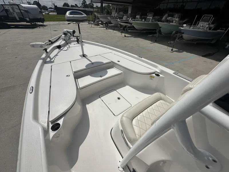 Slide: The Image of 2022 Blue Wave 2400 PURE BAY boat interior with seating and storage compartments. - 8