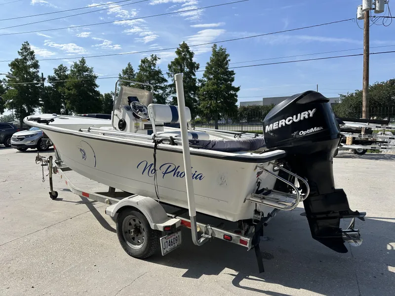 Slide: The Image of 2009 Trophy 181 Bay Boat with Mercury OptiMax engine on trailer. - 11