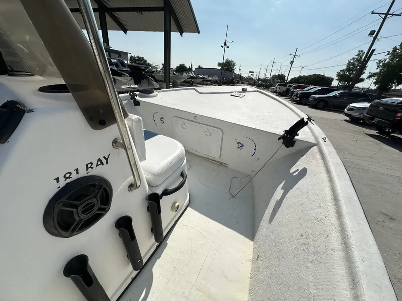 Slide: The Image of 2009 Trophy 181 Bay Boat interior view, showing seating and storage compartments. - 6