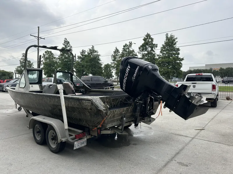 Slide: The Image of Custom 2004 boat model 23 with Mercury Optimax engine on trailer. - 3