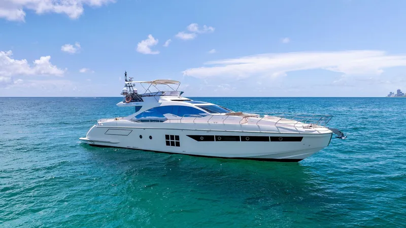 Slide: The Image of 2019 Azimut 77S yacht cruising on clear blue ocean waters. - 1