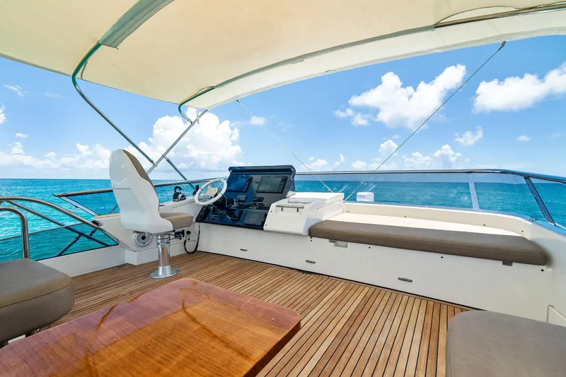 Slide: The Image of Luxurious 2019 Azimut 77S yacht deck with ocean view and modern helm. - 11