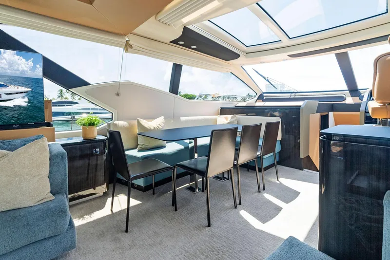 Slide: The Image of Luxurious interior of 2019 Azimut 77S yacht with modern dining area and panoramic windows. - 17