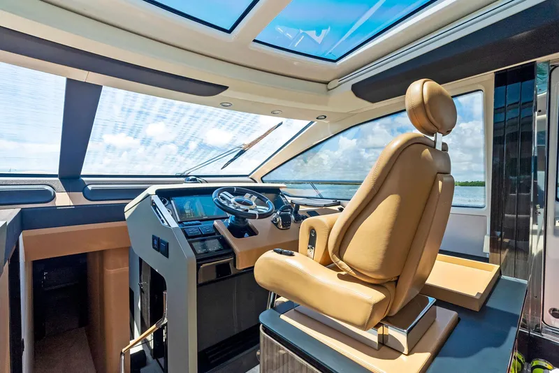 Slide: The Image of Luxurious 2019 Azimut 77S yacht cockpit with leather seating and panoramic windows. - 18