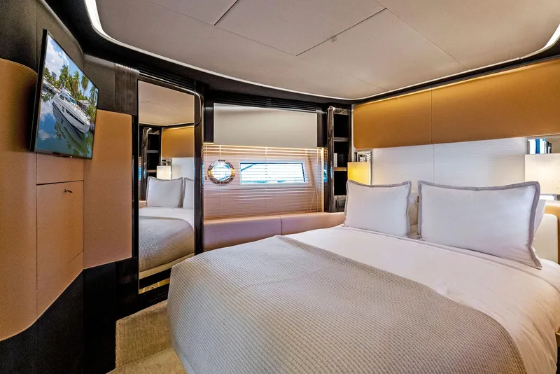Slide: The Image of Luxurious bedroom interior of 2019 Azimut 77S yacht with modern design and cozy bedding. - 24