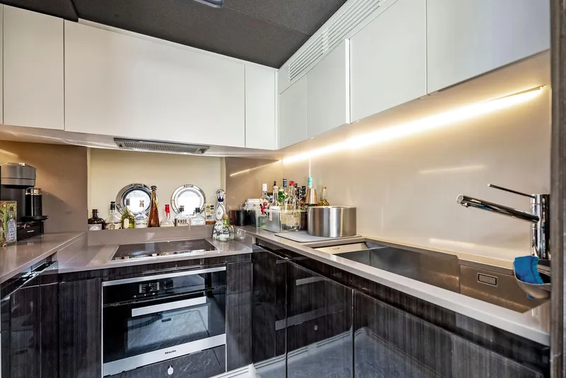 Slide: The Image of Modern kitchen interior on 2019 Azimut 77S yacht with sleek cabinetry and appliances. - 27