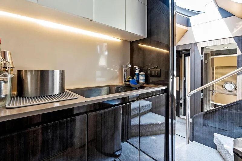 Slide: The Image of Luxurious interior of 2019 Azimut 77S yacht with modern kitchen design. - 29