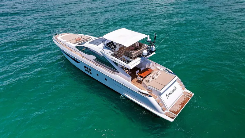 Slide: The Image of Luxurious 2019 Azimut 77S yacht cruising on clear blue waters. - 3