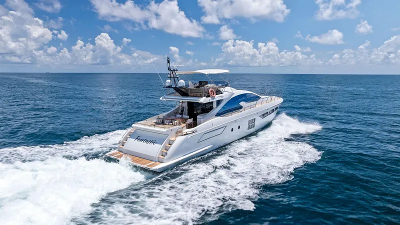Slide: The Image of 2019 Azimut 77S yacht cruising on open ocean under blue sky. - 4