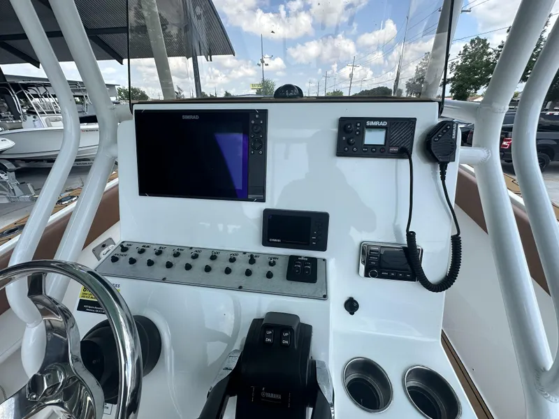 Slide: The Image of Clearwater 2300 boat dashboard with Simrad electronics and Yamaha controls, 2019 model. - 12