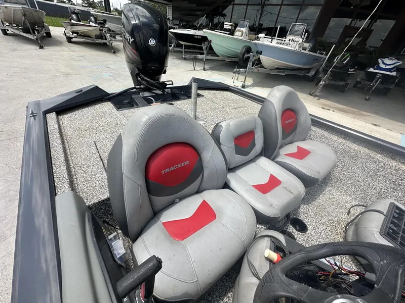 Slide: The Image of 2015 Tracker Pro Team 190 TX boat interior with Mercury outboard motor. - 5