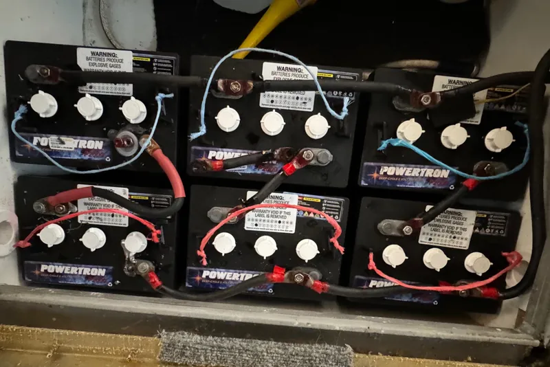 Slide: The Image of Outdoor grill on 2005 Fantasy Houseboat 19x90, docked near lush green trees. - 12