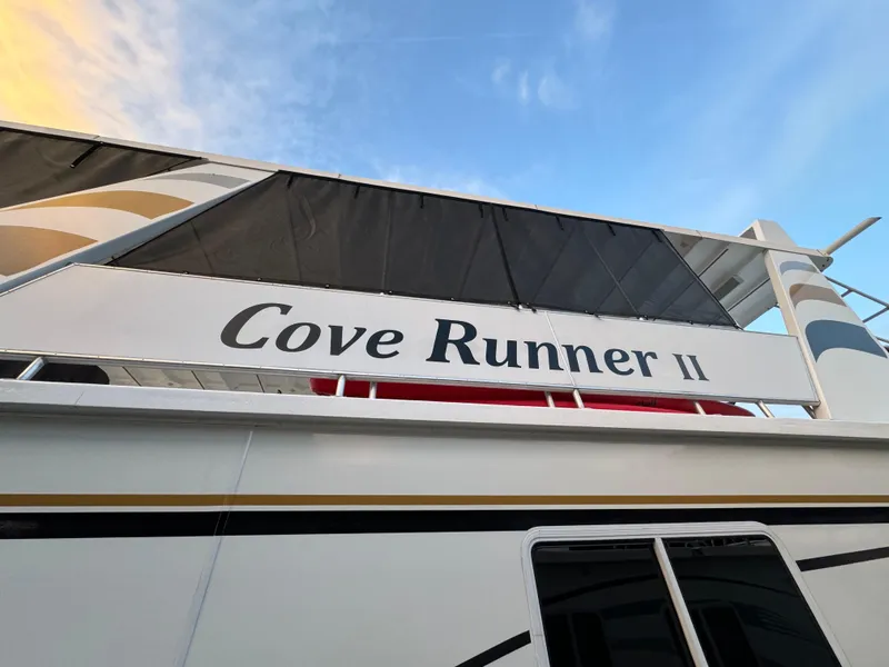 Slide: The Image of Outdoor seating area on 2005 Fantasy Houseboat 19x90 with round table and chairs. - 13