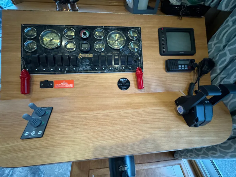 Slide: The Image of Spacious living area in a 2005 Fantasy Houseboat 19x90 with a cozy sectional sofa. - 22