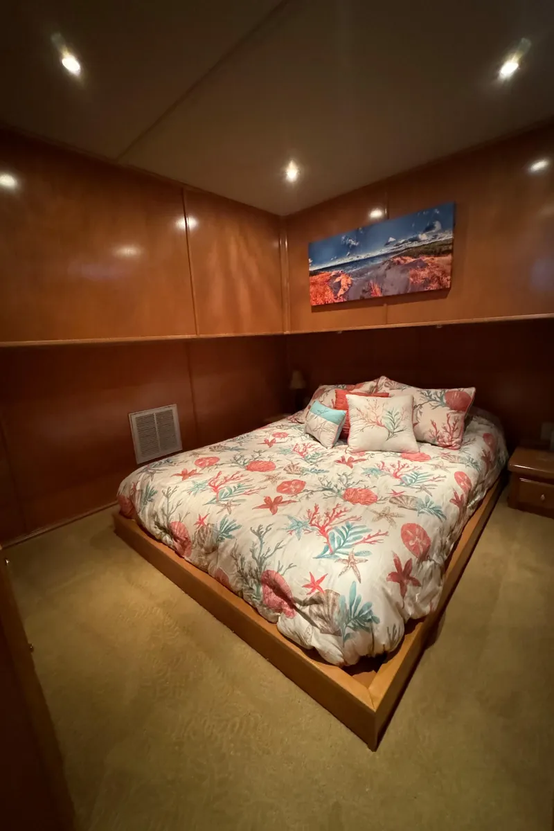 Slide: The Image of Modern kitchen in a 2005 Fantasy Houseboat 19x90 with wooden cabinets and white appliances. - 31