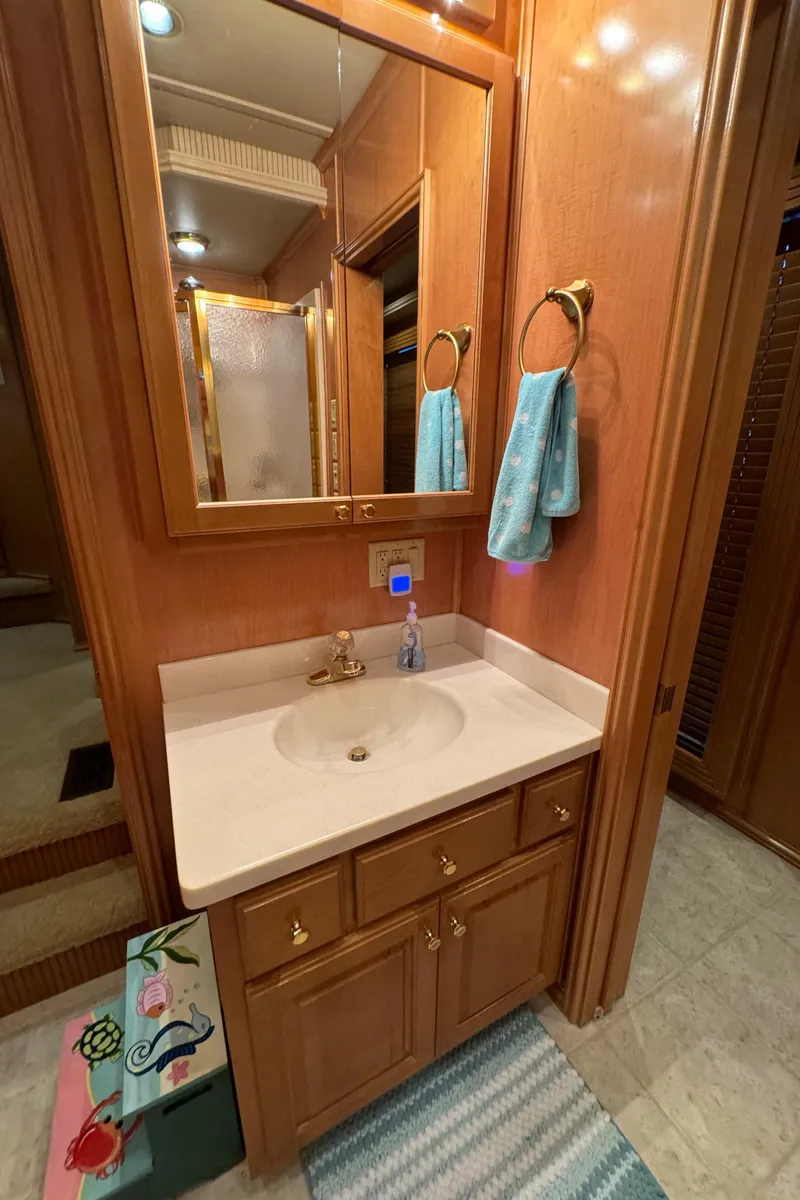 Slide: The Image of 2005 Fantasy Houseboat 19x90 kitchen with wooden cabinets and modern appliances. - 36