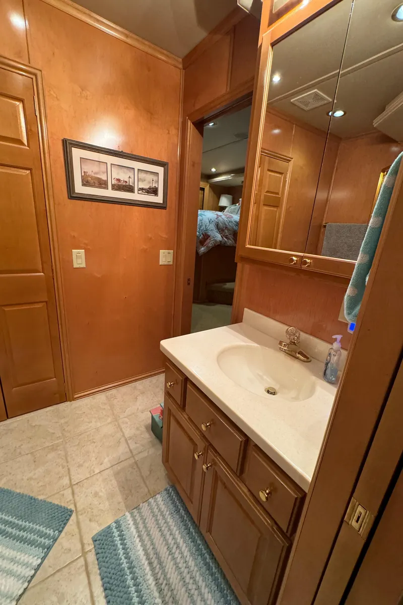 Slide: The Image of Luxurious kitchen interior of a 2005 Fantasy Houseboat 19x90 with wooden cabinetry and modern appliances. - 37