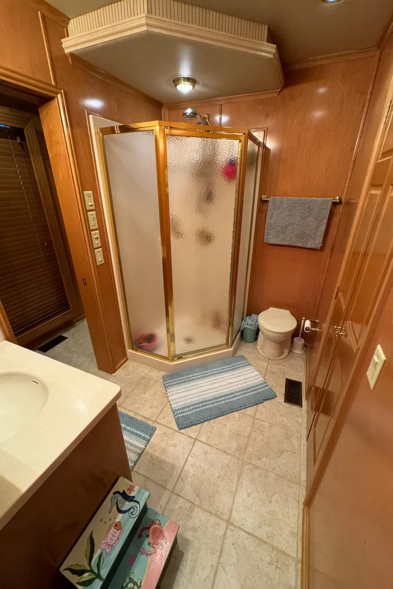 Slide: The Image of Luxurious kitchen interior of 2005 Fantasy Houseboat 19x90 with wooden cabinets and tiled floor. - 38