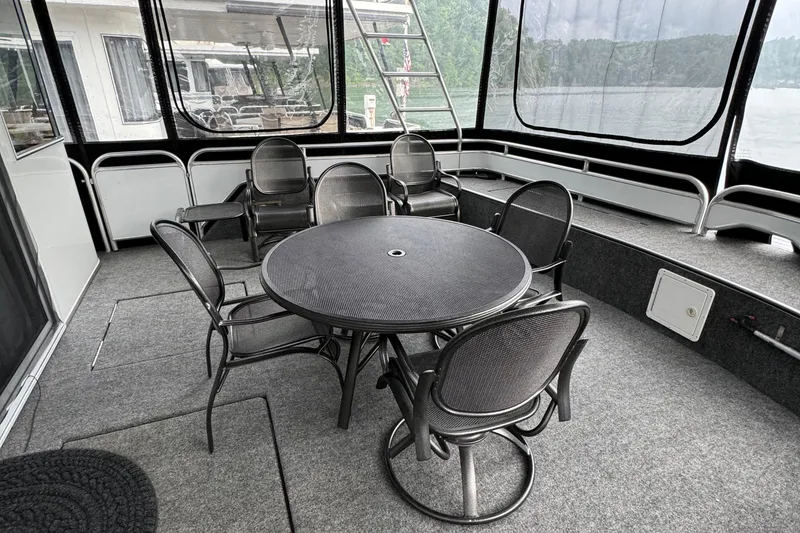 Slide: The Image of 2005 Fantasy Houseboat 19x90 docked under clear blue sky. - 4