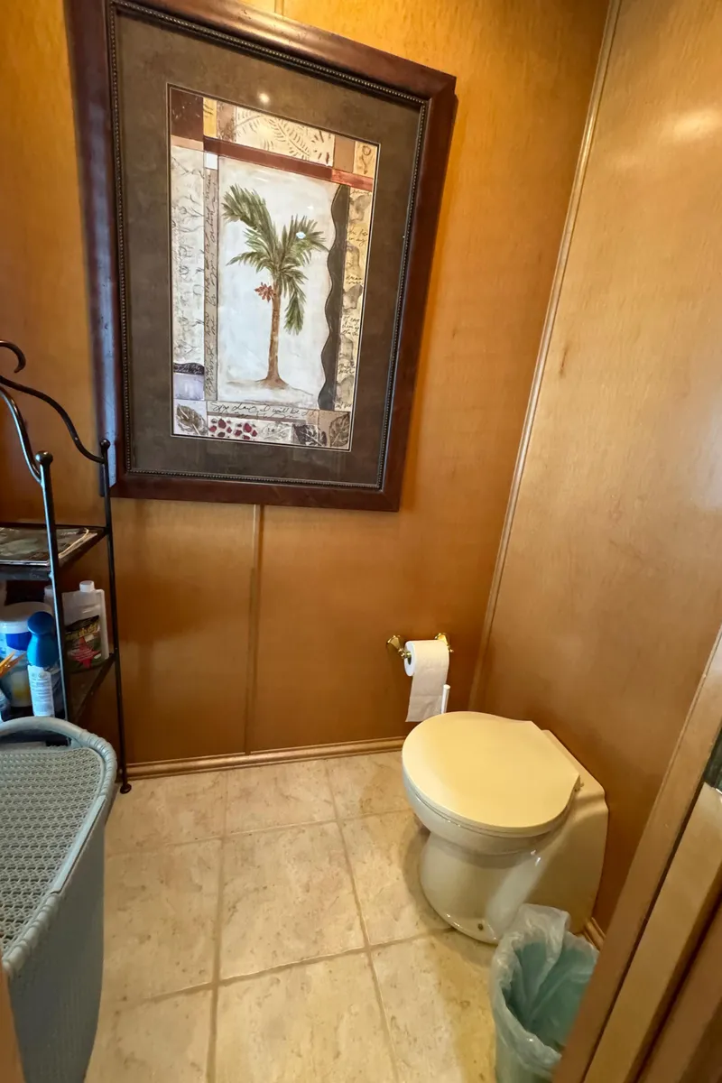 Slide: The Image of 2005 Fantasy Houseboat 19x90 bathroom with shower, toilet, and sink. - 48