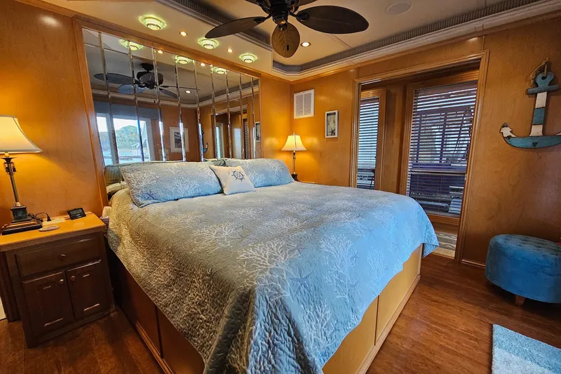 Slide: The Image of Luxurious bedroom in 2005 Fantasy Houseboat 19x90 with elegant decor and mirrored walls. - 51
