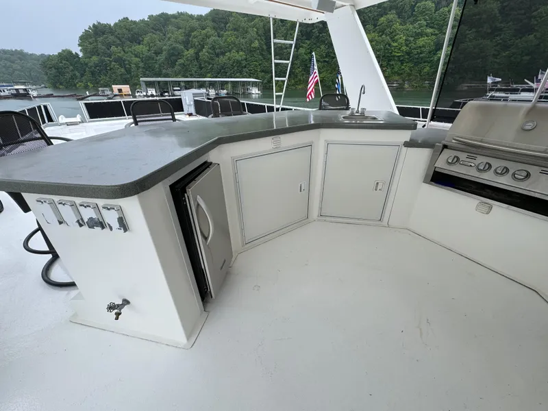 Slide: The Image of Outdoor seating area on 2005 Fantasy Houseboat 19x90 with round table and chairs. - 6