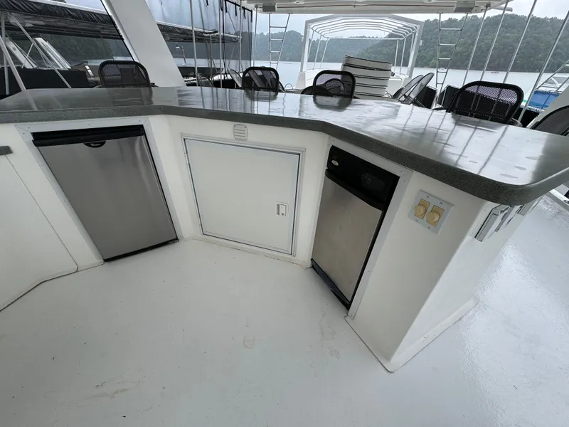 Slide: The Image of Outdoor kitchen on a 2005 Fantasy Houseboat 19x90 with grill and sink. - 7