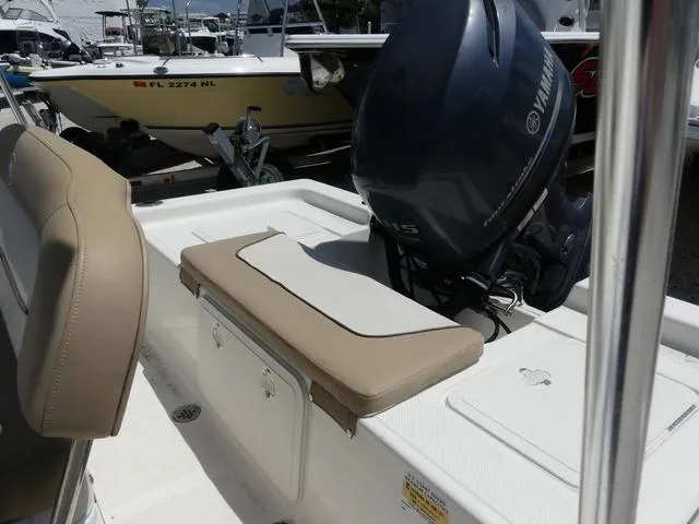 Slide: The Image of 2014 Key West 176BR boat with Yamaha outboard motor in a marina. - 11