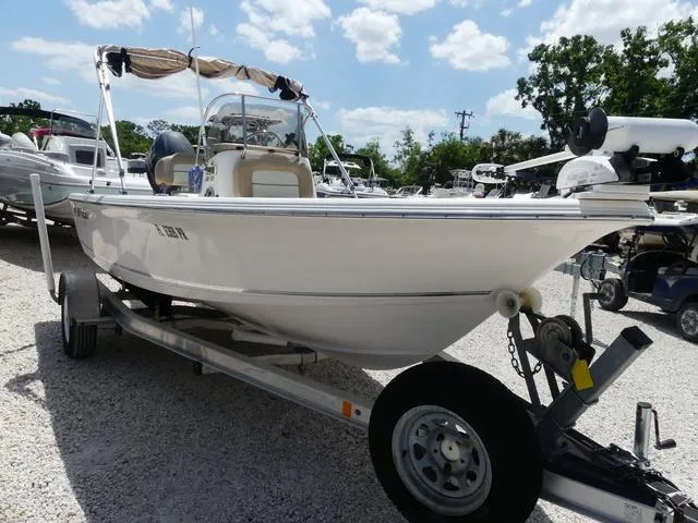 Slide: The Image of 2014 Key West 176BR boat on a trailer in a gravel lot. - 3