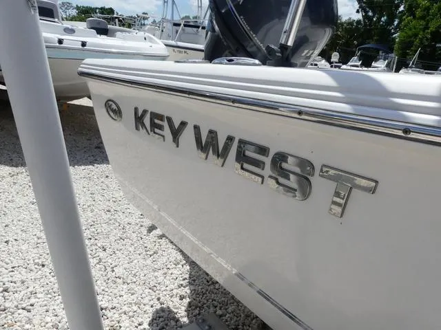 Slide: The Image of 2014 Key West 176BR boat on trailer, side view, with registration number FL 6369 PR. - 4