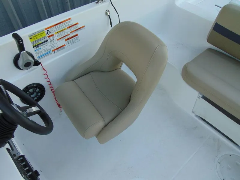 Slide: The Image of Captain's seat of a 2021 Hurricane SunDeck Sport 188 OB boat. - 11