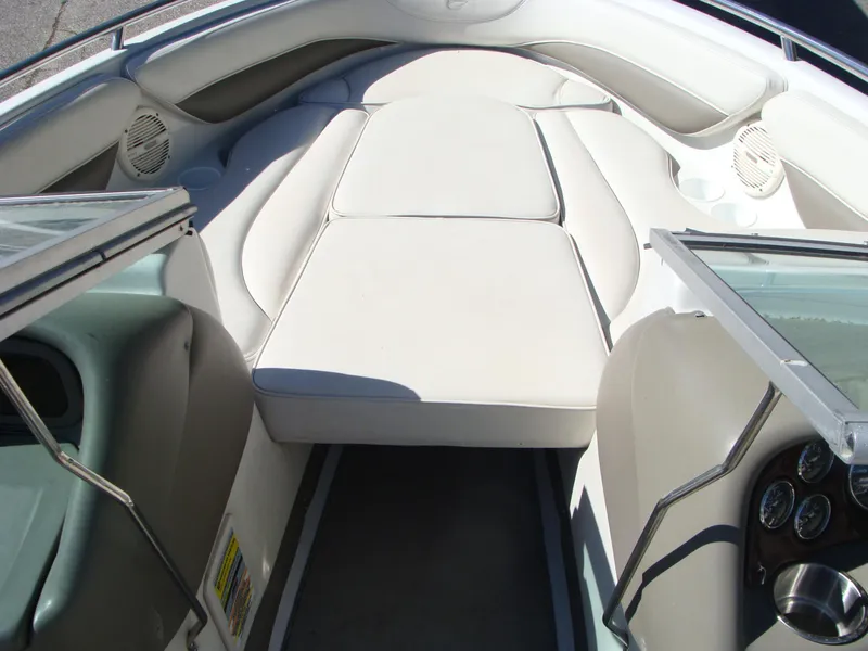 Slide: The Image of Interior of 2005 Crownline Bowrider 202 BR boat with white seating. - 4
