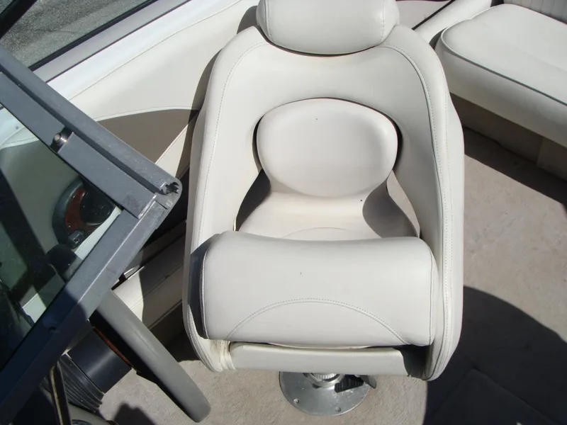 Slide: The Image of Captain's seat of a 2005 Crownline Bowrider 202 BR boat. - 5