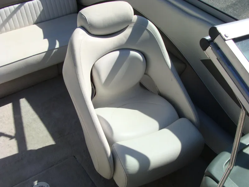 Slide: The Image of 2005 Crownline Bowrider 202 BR interior seating with white upholstery. - 6