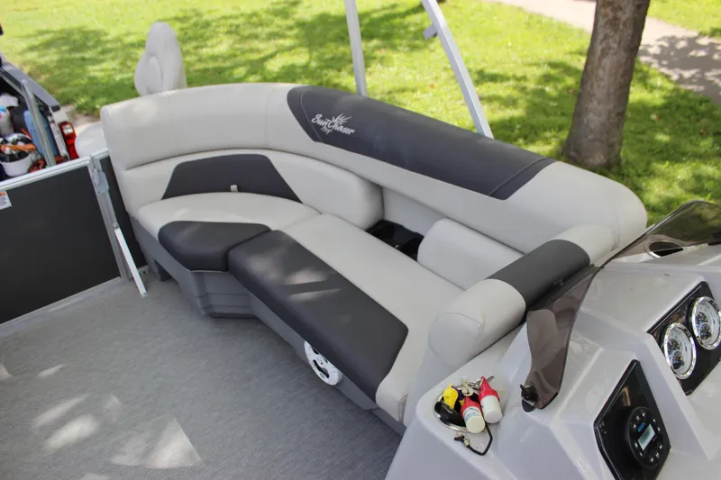 Slide: The Image of 2021 SunChaser Geneva Cruise 24 SB interior seating with gray and black upholstery. - 13
