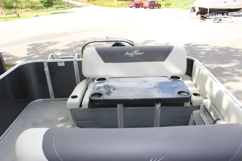 Slide: The Image of 2021 SunChaser Geneva Cruise 24 SB boat interior with seating and table. - 15