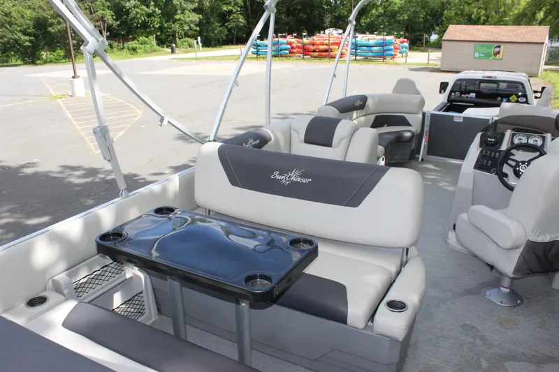 Slide: The Image of 2021 SunChaser Geneva Cruise 24 SB pontoon boat interior with seating and table. - 17