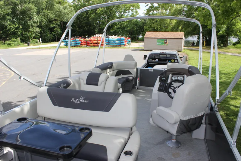 Slide: The Image of 2021 SunChaser Geneva Cruise 24 SB pontoon boat interior with seating and control console. - 18