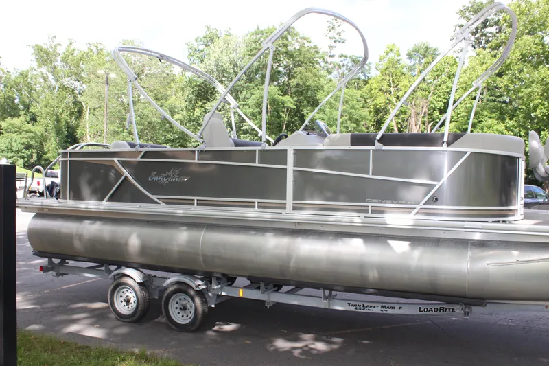 Slide: The Image of 2021 SunChaser Geneva Cruise 24 SB pontoon boat on LoadRite trailer. - 24